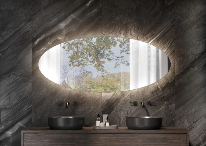 ELIPSE maatwerk spiegel – ovaal design met indirecte LED-verlichting, touchdimmer, spiegelverwarming en Bluetooth-audio. Verkrijgbaar in diverse afmetingen (400×800 mm – 1000×2000 mm) voor een luxe en functioneel interieur.