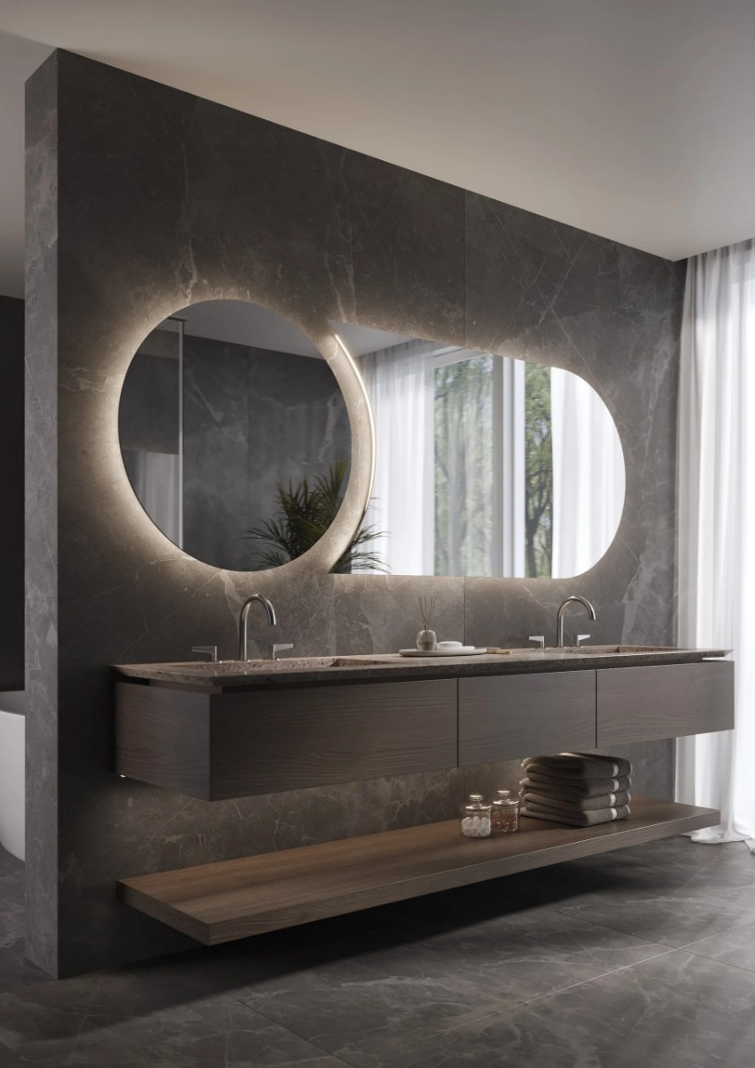 De SPLIT spiegel is een moderne, tweedelige ronde designspiegel met indirecte verlichting, Bluetooth-audio en een digitale klok. Verkrijgbaar in twee maten, tot 1000 mm en 2000 mm, biedt deze spiegel maatwerkopties en een sfeervolle ambiance voor zowel sa - Hover