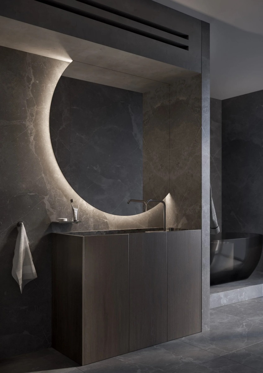 De VENUS spiegel is een moderne tweedelige ronde designspiegel met een unieke afwerking aan de bovenzijde en rechterzijde, ontworpen voor luxe woon- en sanitaire ruimtes. Verkrijgbaar in diverse maten (1200 mm - 2000 mm), met indirecte verlichting voor ee - Hover
